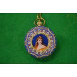 A highly ornate pocket watch with pictorial centre to both sides with enamel and pearl decoration.