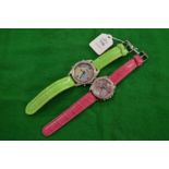 Two decorative large wristwatches.