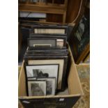 A box of assorted pictures and prints.