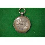 A ladies' silver pocket watch with engraved dial.