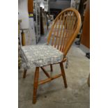 A set of four pine kitchen chairs.