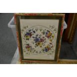 A collection of framed and glazed embroidered pictures.