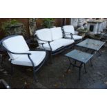 A five piece cast aluminium garden lounge set comprising two seater settee, pair of armchairs,