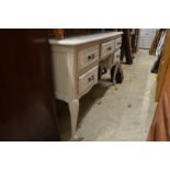 A French style grey painted kneehole dressing table or desk.