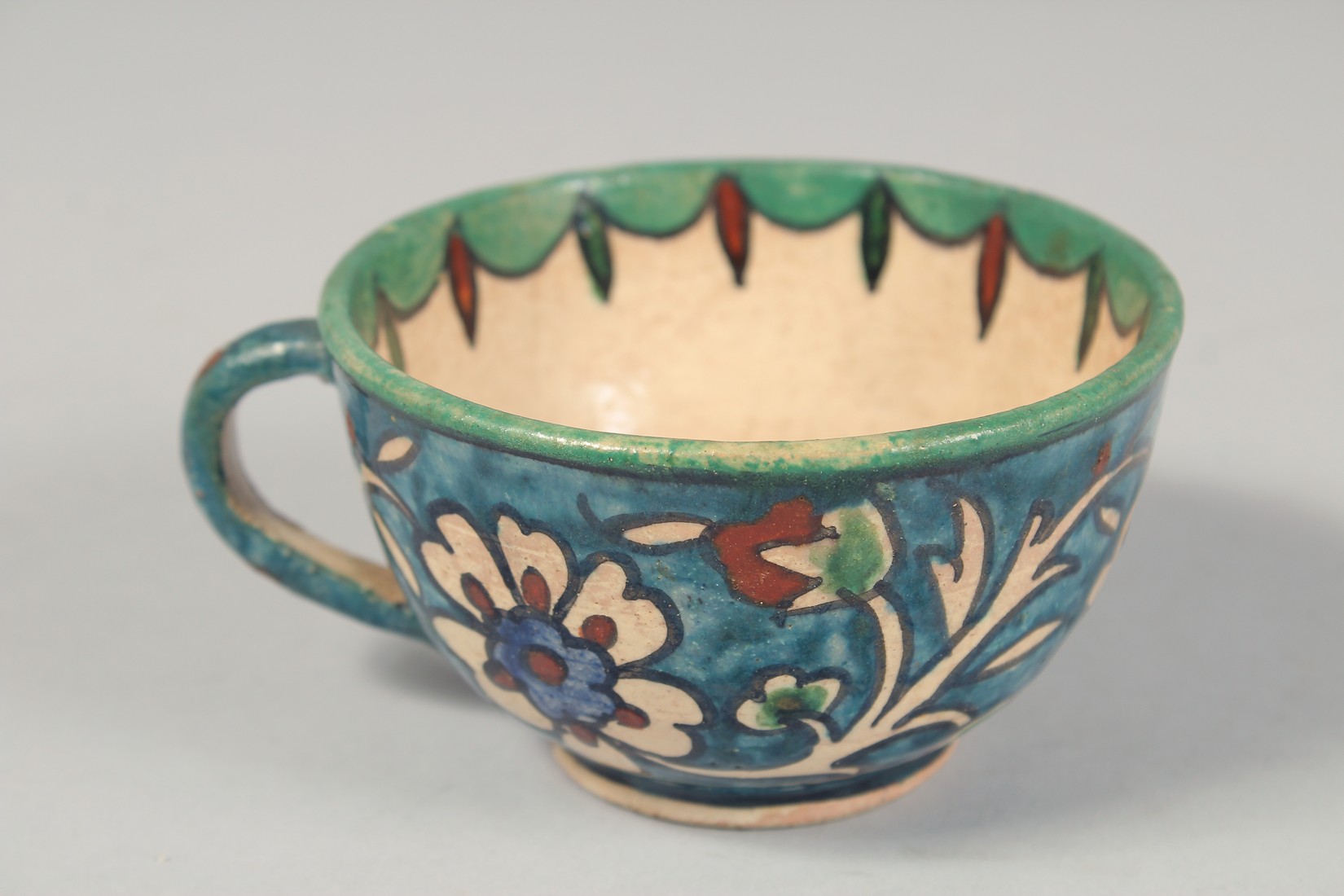 A PALESTINIAN TURQUOISE GLAZE POTTERY PART TEA SET, each piece painted with floral decoration, - Image 10 of 10