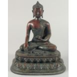 A GOOD LARGE BRONZE BUDDHA, seated upon a lotus base, 29.5cm high.