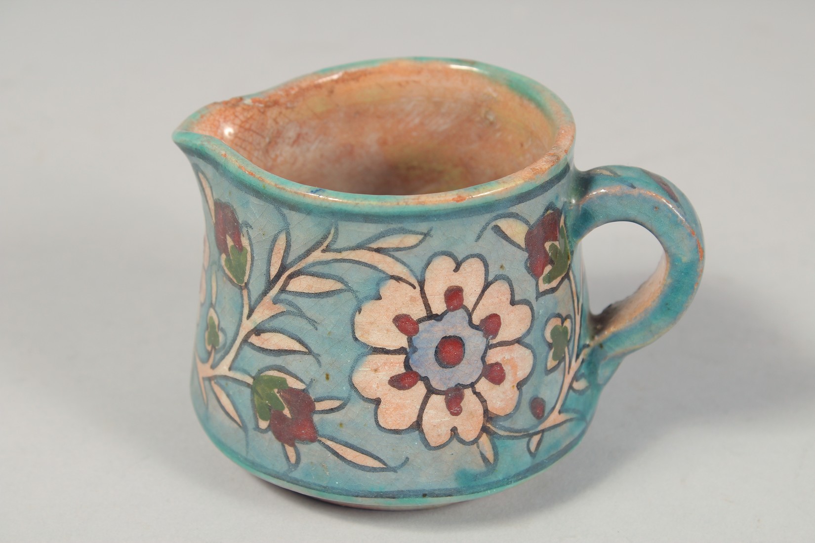 A PALESTINIAN TURQUOISE GLAZE POTTERY PART TEA SET, each piece painted with floral decoration, - Image 7 of 10