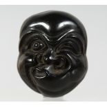 AN UNUSUAL JAPANESE CARVED LACQUERED WOODEN NOH MASK, 4.5cm X 3.5cM