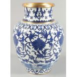 A CHINESE BLUE AND WHITE CLOISONNE VASE, decorated with stylised flower heads and curling vines,