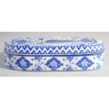 A TURKISH BLUE AND WHITE GLAZED POTTERY PEN BOX, 30cm long.