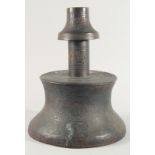 A VERY LARGE ISLAMIC ENGRAVED BRASS CANDLESTICK, with decorative roundels of floral motifs and