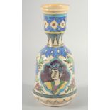 A PERSIAN QAJAR GLAZED POTTERY HUQQA BASE, painted with portrait and floral decoration, 27.5cm