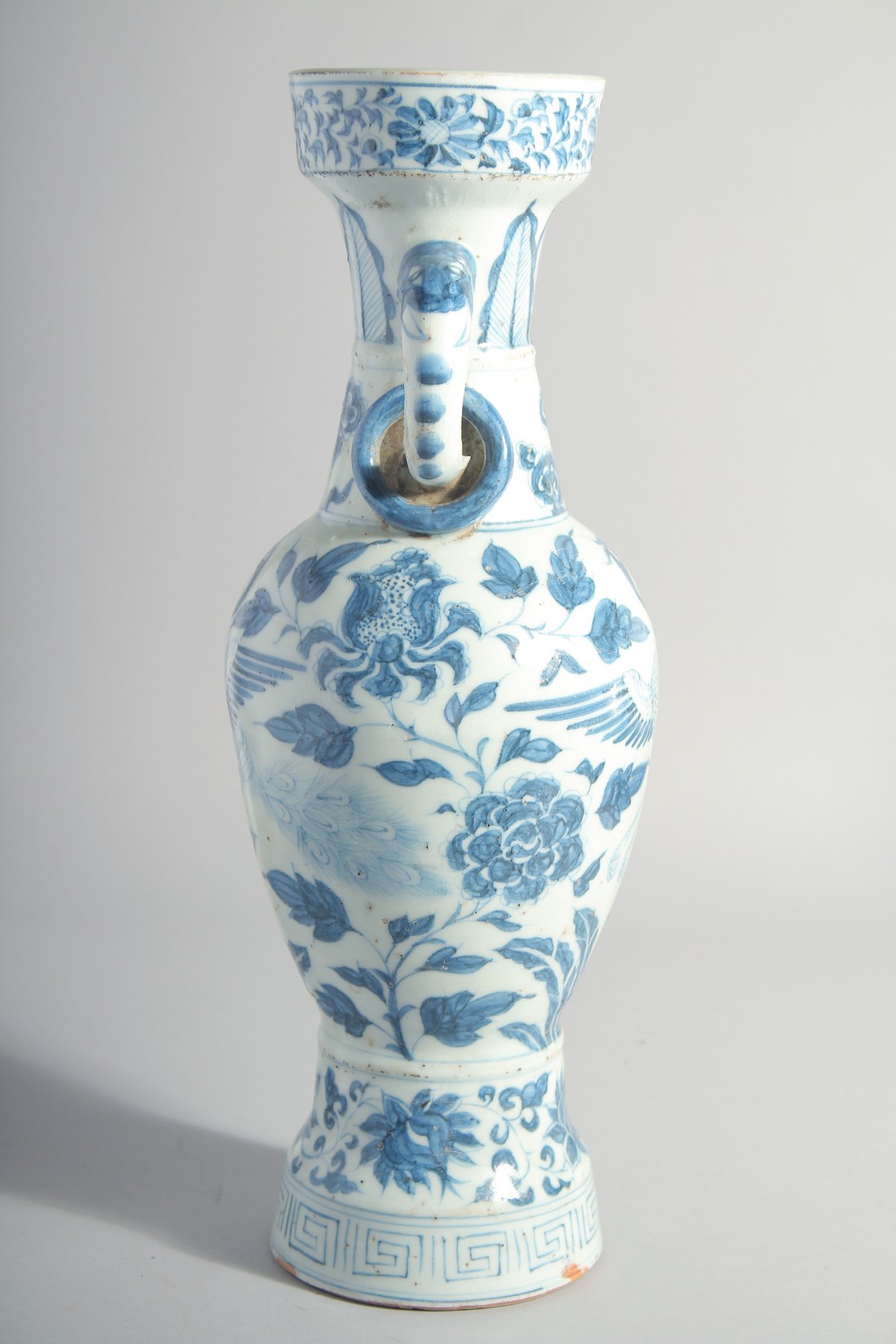 A CHINESE YUAN STYLE BLUE AND WHITE GLAZED POTTERY TWIN HANDLE VASE, painted with birds and flora, - Image 4 of 6