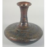 AN EARLY BRONZE CIRCULAR VASE, with chased decoration of a band of various animals, 21cm high.