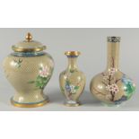 A CHINESE CLOISONNE JAR AND COVER, together with a similar cloisonne bottle vase and a smaller vase,