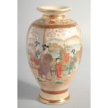 A JAPANESE SATSUMA VASE, painted with two panels depicting a family in a landscape scene, the base