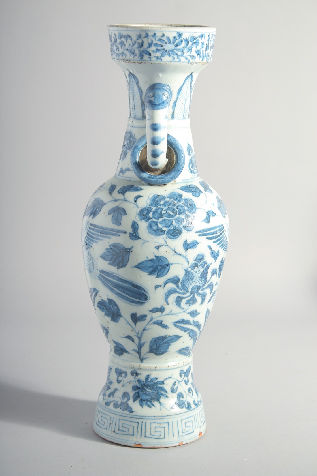 A CHINESE YUAN STYLE BLUE AND WHITE GLAZED POTTERY TWIN HANDLE VASE, painted with birds and flora, - Image 2 of 6