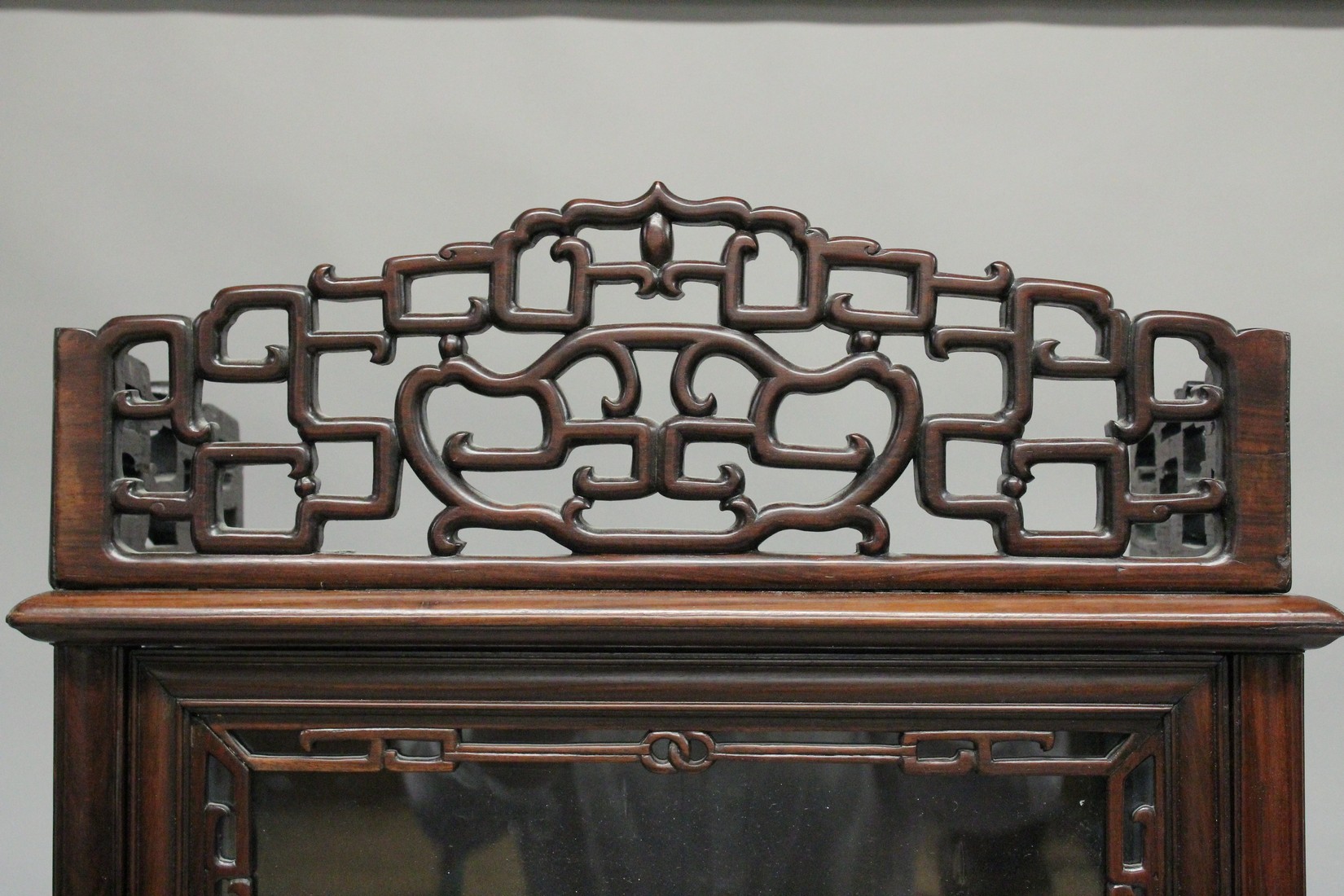 A GOOD CHINESE ROSEWOOD CABINET ON STAND, the top with a pierced cornice, glazed door and sides - Image 2 of 3