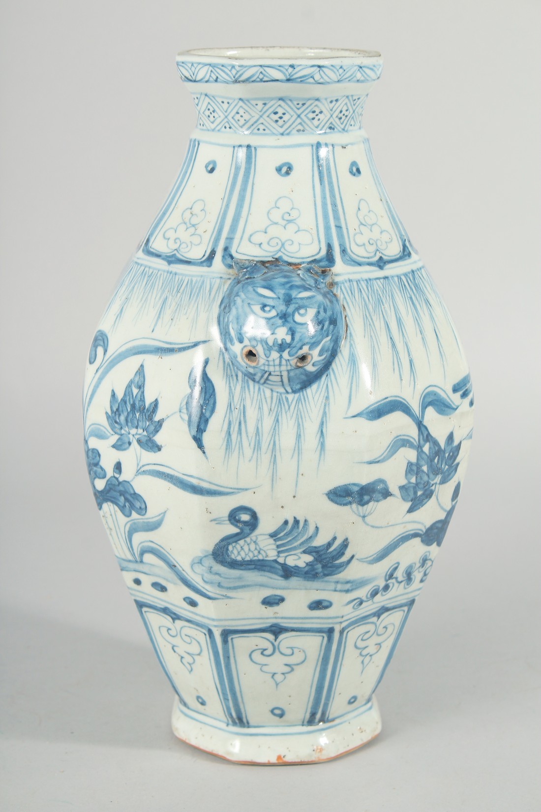 A CHINESE OCTAGONAL BLUE AND WHITE TWIN HANDLE VASE, with moulded lion heads as handles, the body - Image 2 of 6