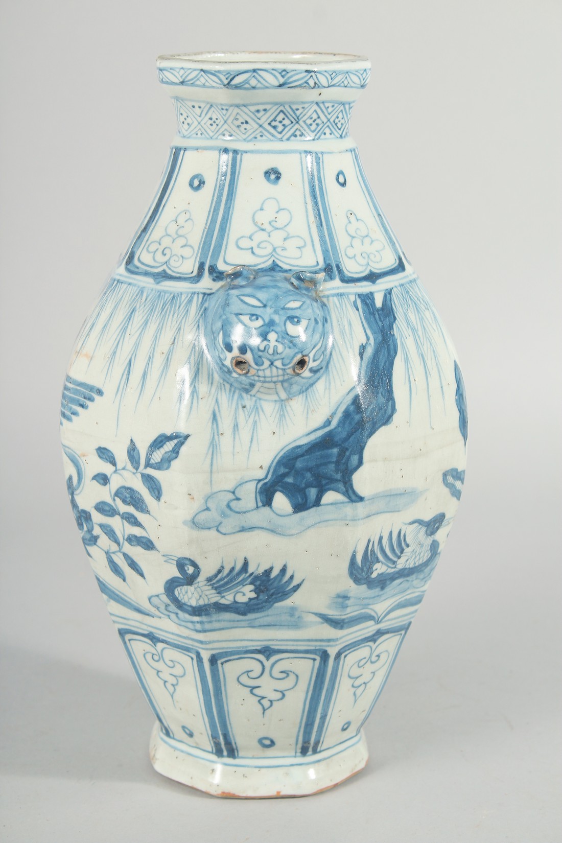 A CHINESE OCTAGONAL BLUE AND WHITE TWIN HANDLE VASE, with moulded lion heads as handles, the body - Image 4 of 6
