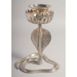 A WHITE METAL COBRA FORM CANDLESTICK, with engraved detail all over, 24cm high.