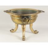 A LARGE BRASS BRAZIER / COOKING BOWL, with inset twin handle bowl, the exterior with twin handles