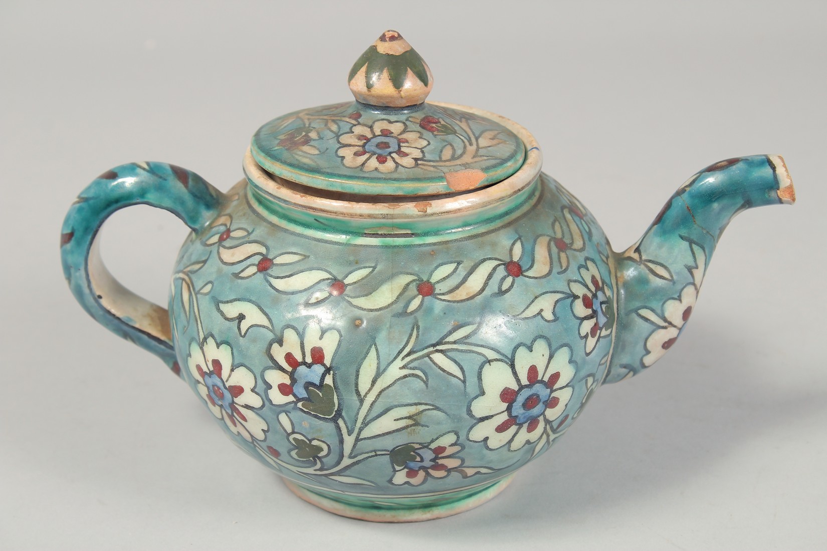 A PALESTINIAN TURQUOISE GLAZE POTTERY PART TEA SET, each piece painted with floral decoration, - Image 8 of 10