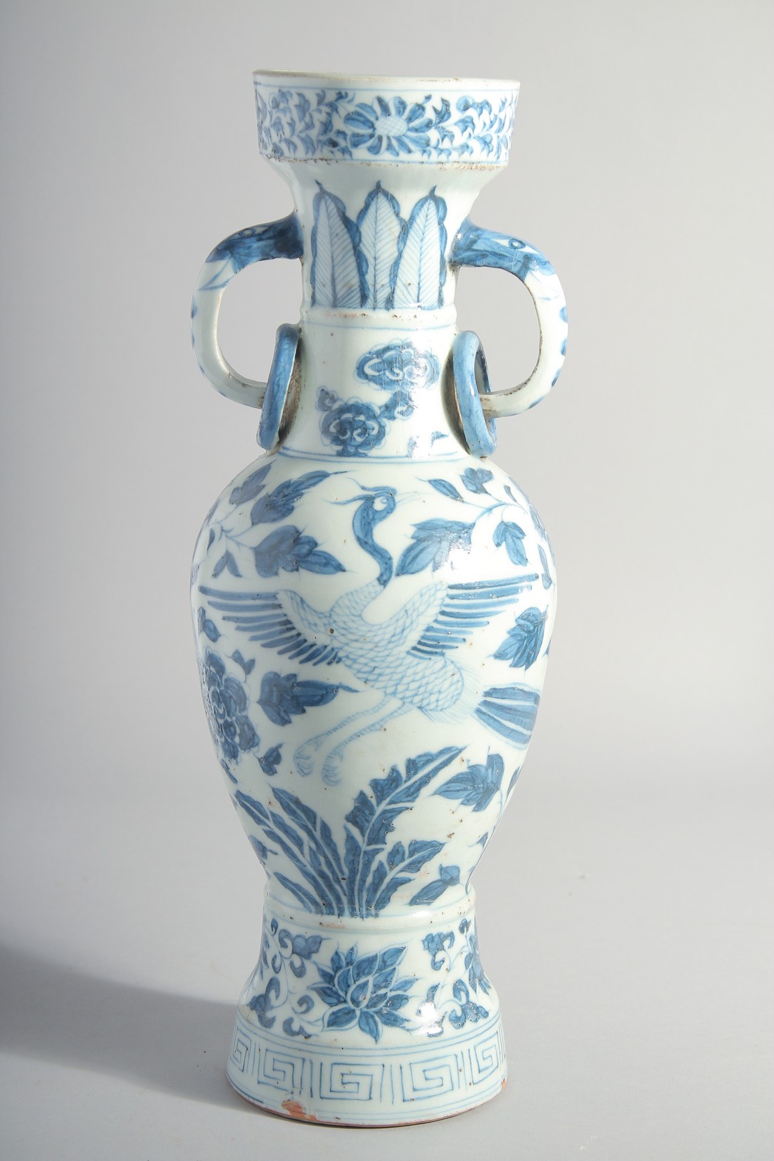 A CHINESE YUAN STYLE BLUE AND WHITE GLAZED POTTERY TWIN HANDLE VASE, painted with birds and flora, - Image 3 of 6