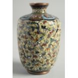 A SMALL CHINESE CLOISONNE ENAMEL VASE with butterflies. 3.5ins high.