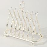 A SILVER PLATED CROSS RIFLES TOAST RACK.