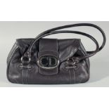 A CHRISTIAN DIOR VINTAGE LEATHER BAG with chrome "C D" and two handles 13ins long, 8 ins deep.