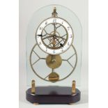 AN OPEN FACE GLASS CLOCK on a marble base. 14ins high.