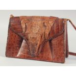 A 1940's - 1950's CUBAN ALLIGATOR SKIN AND HEAD HANDBAG, the fold over flap with alligator head,