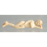 A CARVED BONE DOCTOR'S NUDE FIGURE.