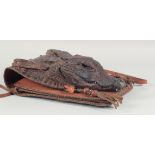 A RARE ALLIGATOR SKIN BROWN HANDBAG with two handles, the flap with a small head and two pairs of