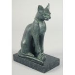 A RARE CARVED STONE EGYPTIAN SEATED CAT. 6ins high on a marble base.