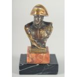 A SMALL BRONZE BUST OF NAPOLEON, stamped Waterloo, on a marble plinth. 3ins high.