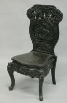 A JAPANESE HALL CHAIR with curved decoration, depicting a tiger beneath a tree.