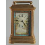 A SEVRES MINI BRASS CARRIAGE CLOCK with porcelain panels. 3ins high.