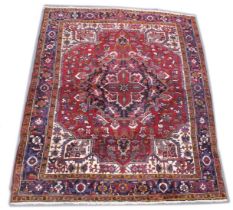 A PERSIAN DESIGN CARPET, red ground with stylised decoration. 10ft x 8ft.