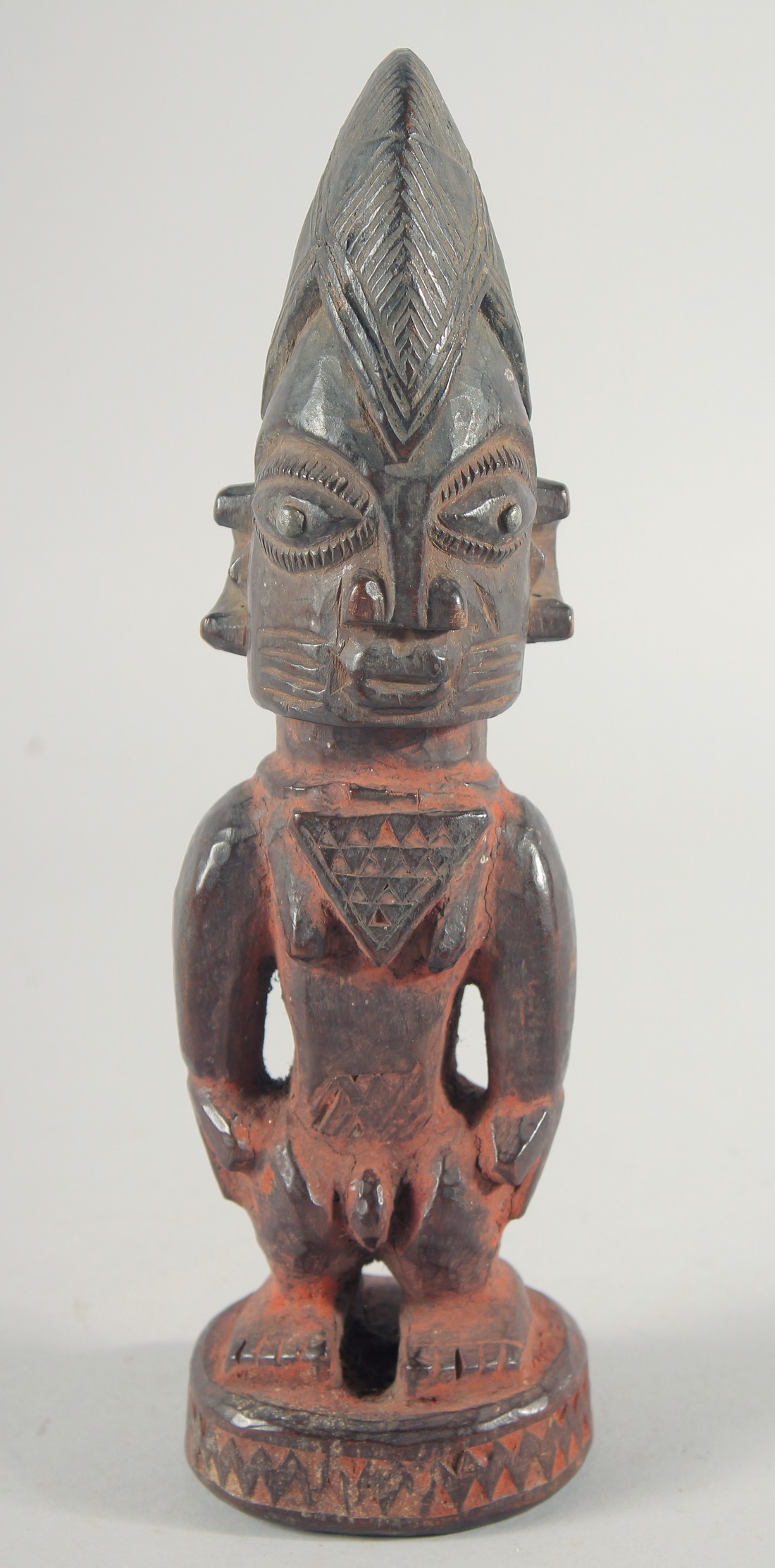 A GOOD CARVED WOOD YORUBA STAND UP FIGURE. 10.5ins high.