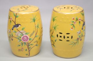 A PAIR OF CHINESE STYLE BARREL SEATS decorated with birds on a branch. 1ft 5ins high.