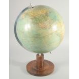 A GERMAN GLOBE OF THE WORLD BY POLITIS ERD GLOBUS. 12ins diameter on a wooden base.