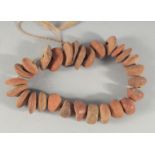 A STING OF ANTIQUITY TERRACOTTA BEADS.