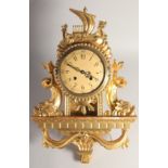 A SCANDINAVIAN GILT WALL CLOCK. 22ins long.