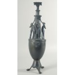 A GOOD LARGE BRONZE GRAND TOUR EWER with Egyptian figure and horses on a stand with three claw feet.