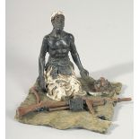 A VIENNA PAINTED COLD CAST BRONZE GROUP, a man with a gun. 4ins high.