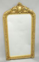 A LARGE DECORATIVE OVER MANTLE MIRROR.