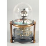 A SMALL GLASS DOMED FISH CLOCK. 5ins high.