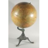 A LARGE AMERICAN GLOBE OF THE WORLD by C. F. WISE, CHICAGO. 18ins diameter on a cast iron base.